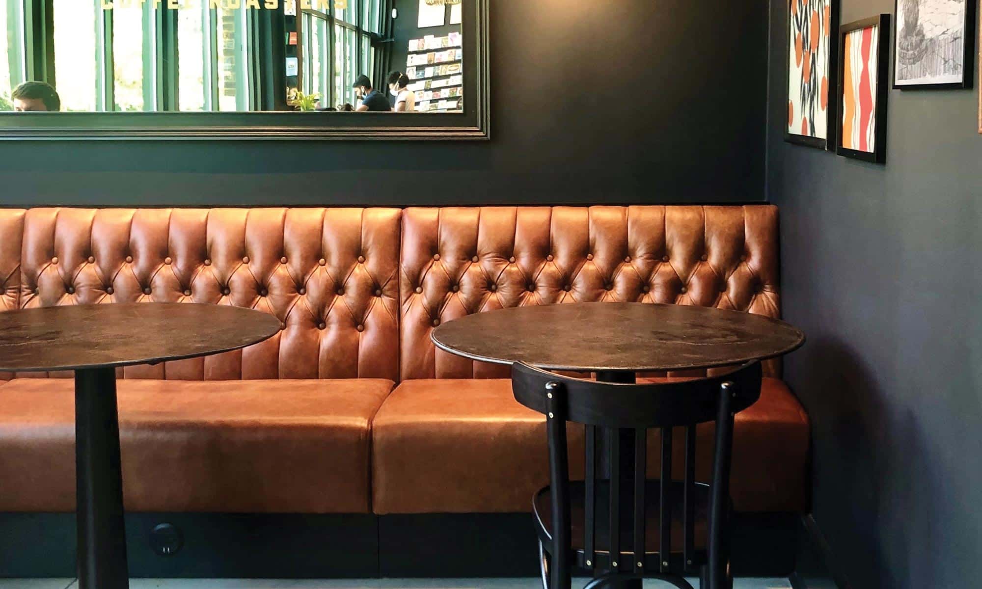 Delmore banquette upholstered in Antiquity leather