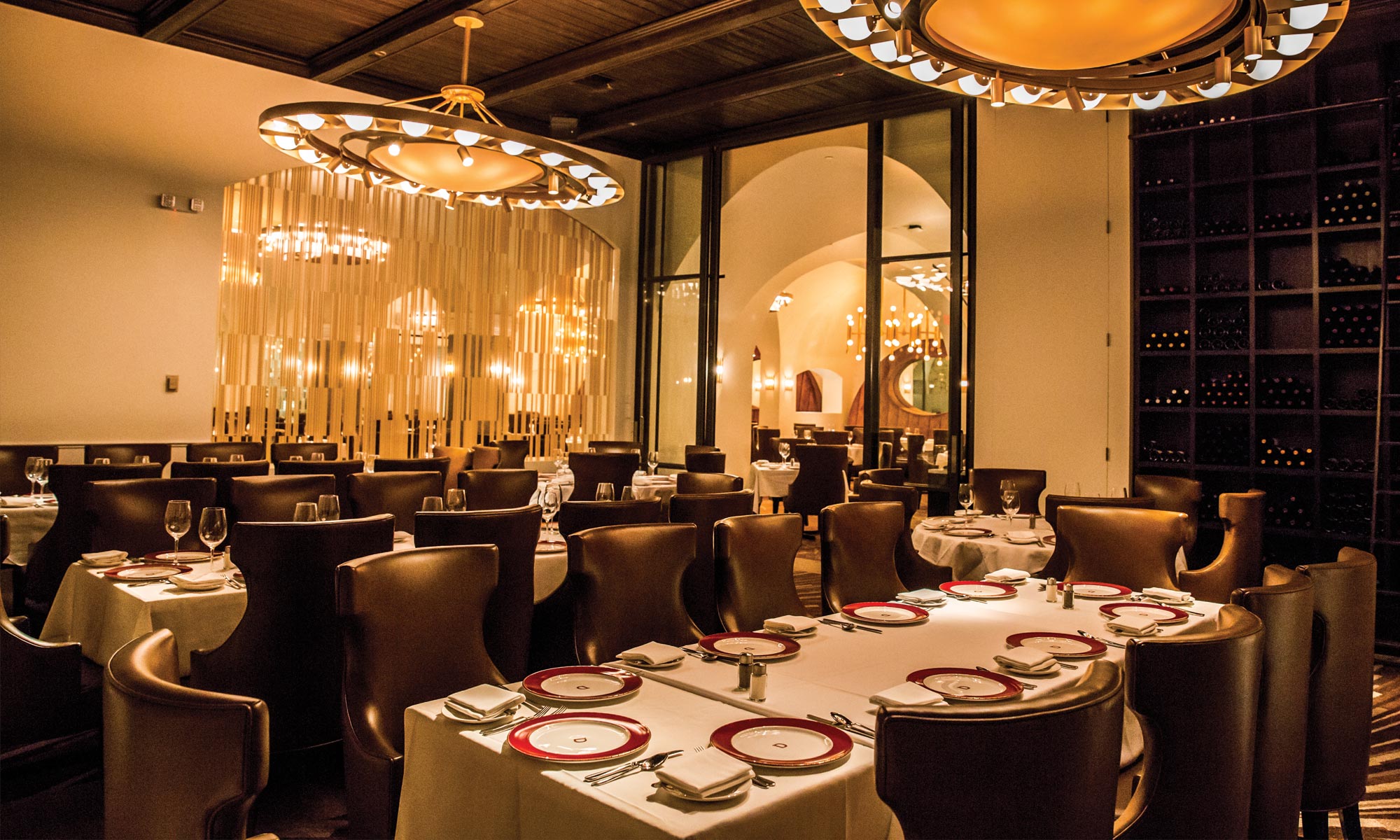 Alinea dining chairs upholstered in Barcelona leather at Delmonico Steak House
