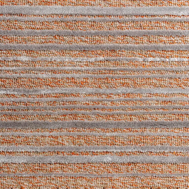 Beam is an orange and grey striped rug by Moshari Studio for Jamie Stern