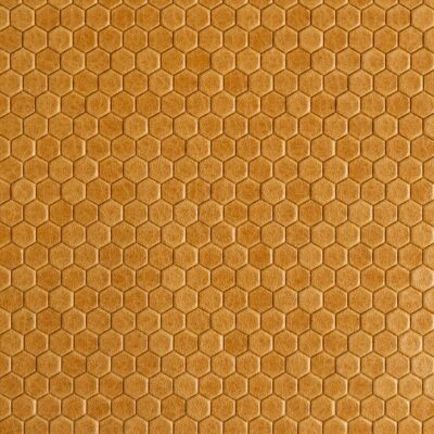 Jamie Stern's new Honeycomb leather blends the rich tactility of pull-up leather with unparalleled embossing precision. The tight hexagon pattern subtly juxtaposes the leather's pure aniline finish and mottled coloration to create a buzzworthy upholstery product suitable for all manner of projects.