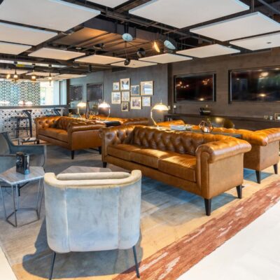 Presidents Plaza lobby with Jamie Stern Rug and Baker Street Sofa