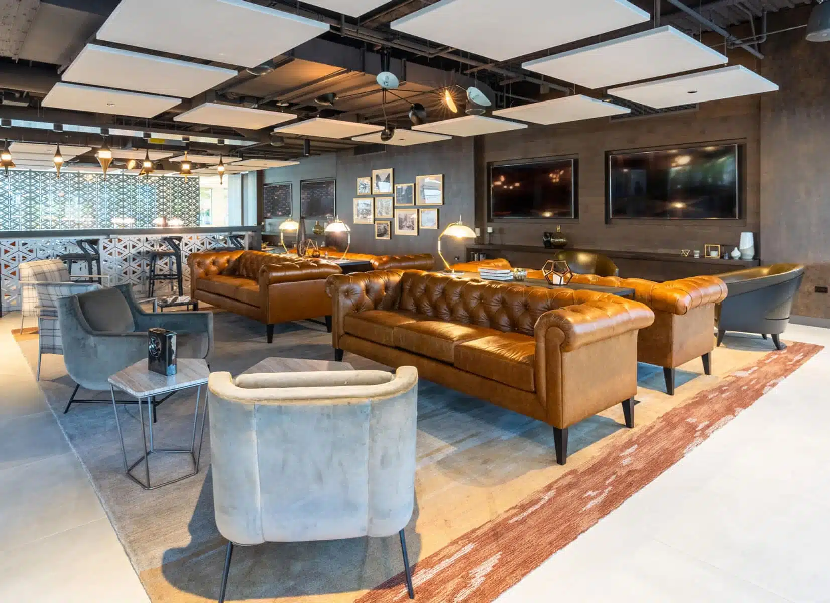 Presidents Plaza lobby with Jamie Stern Rug and Baker Street Sofa