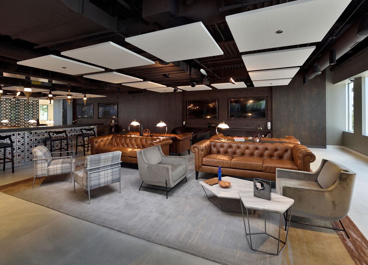 Presidents Plaza lobby with Jamie Stern Rug and Baker Street Sofa